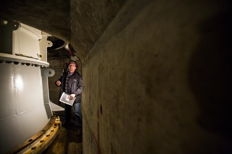SMUD worker Bill Collins surveying part of a turbine housing several stories below, inside Union Valley powerhouse. SMUD worker Bill Collins surveying part of a turbine housing several stories below, inside Union Valley powerhouse.
