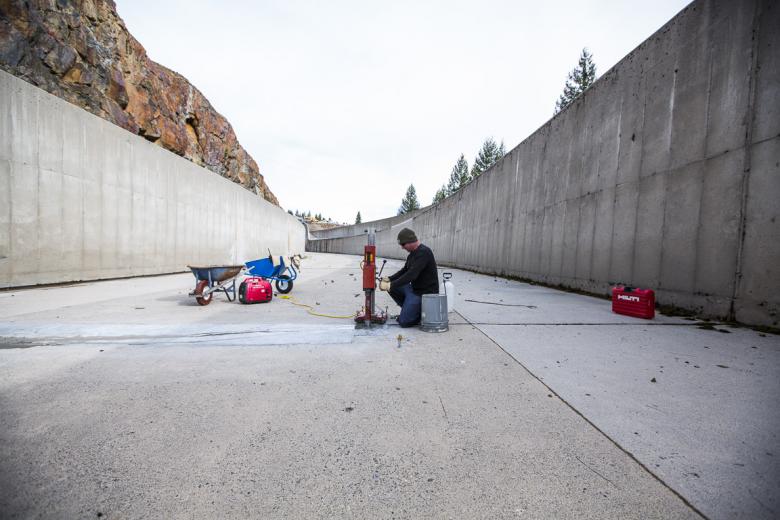 SMUD workers preparing to drill a core sample from the Union Valley spillway to evaluate bonding of a capping repair. SMUD workers preparing to drill a core sample from the Union Valley spillway to evaluate bonding of a capping repair.