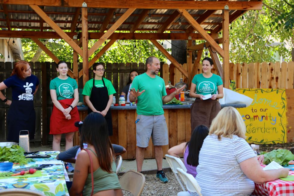 Randy Stannard, of Oak Park Sol, introduces guests from the Food Literacy Center before a cooking class. (Photo courtesy Joan Cusick)