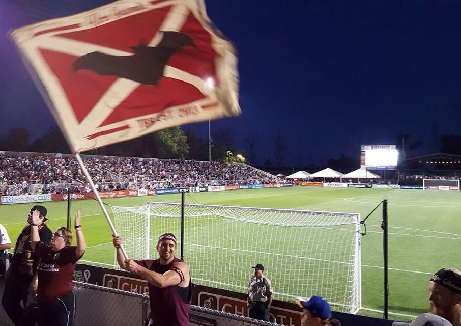Tower Bridge Battalion member Jon Conover waves a Republic FC flag at a recent game. (Photo courtesy of Jon Conover)
