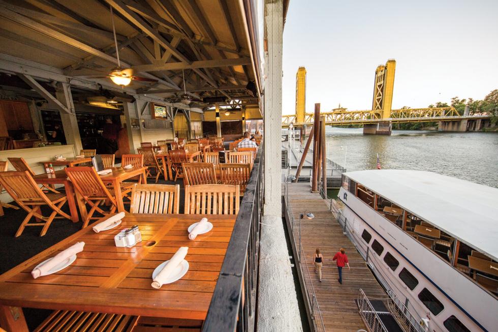 Diners on the patio of Rio City Cafe enjoy a view of the Sacramento River.