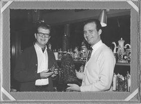 Glen Forbes and William (Bill) Snyder circa 1966 pictured with authentic German beer steins in their Town & Country Village store. 