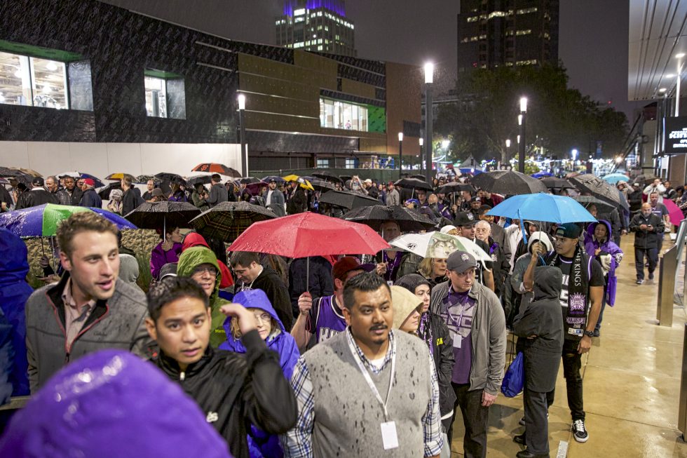 Fans brave the rain before entering Golden 1 Center for the Kings’ first regular-season game Oct. 27, 2016.