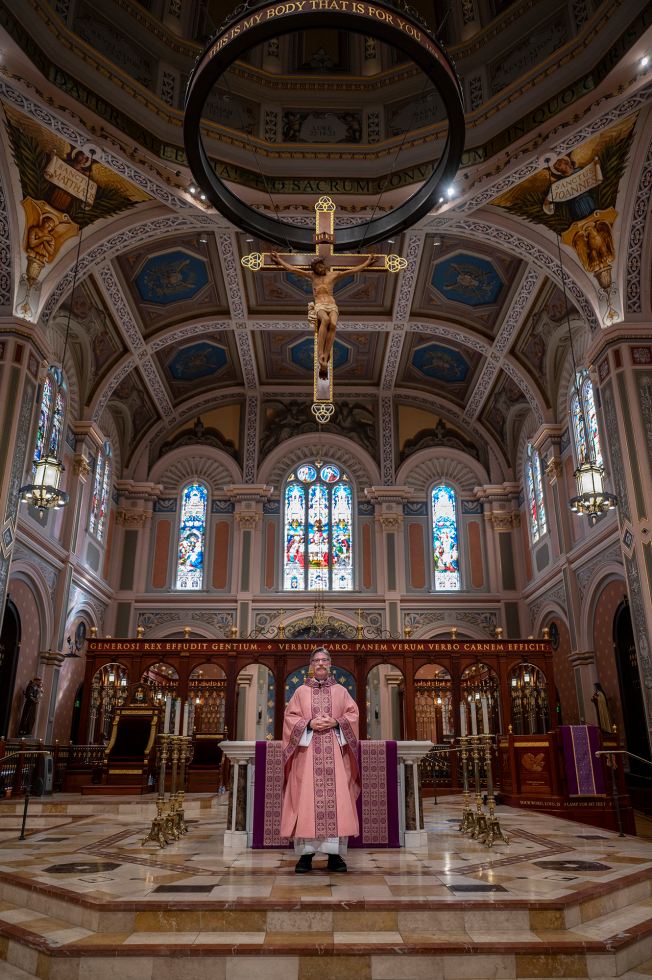 Michael O’Reilly stands near the altar of Cathedral of the Blessed Sacrament.