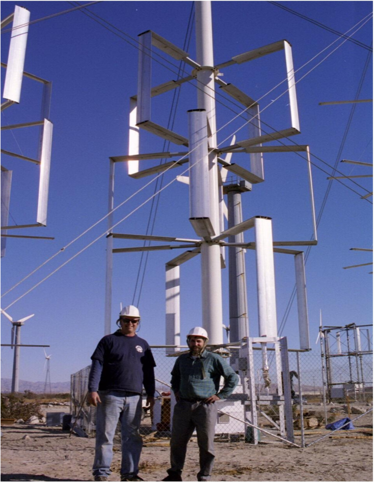 Wind Harvest engineers Olamide Ajala and Omar Garcia visit a different model of turbine at a Texas testing site. (Photo courtesy of Wind Harvest)